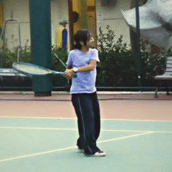 Jewell as a young girl with a racket, training