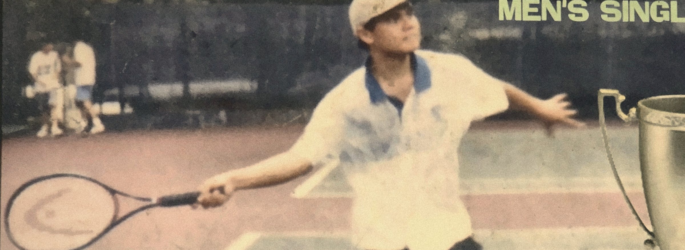 Sikap Tennis Cup, 1999: a young player mid-forehand, trophy at the edge of the frame
