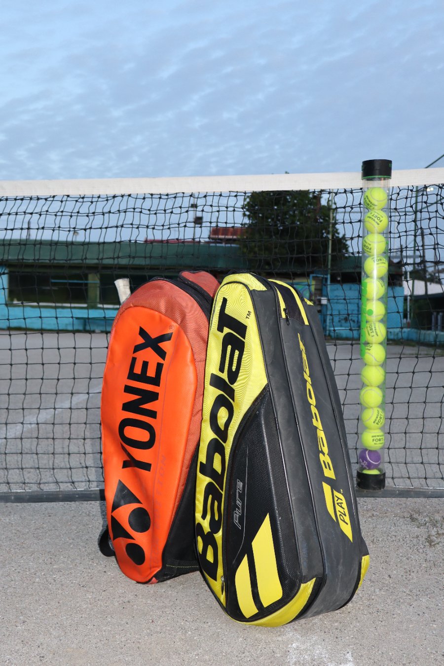 Tennis ball tube at the net